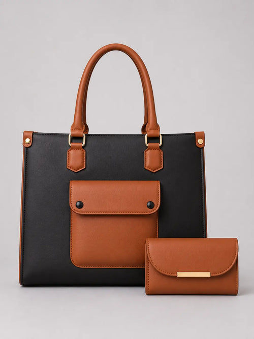 A structured tote bag in black and tan leather with a matching tan wallet, photographed on a neutral light gray background.
