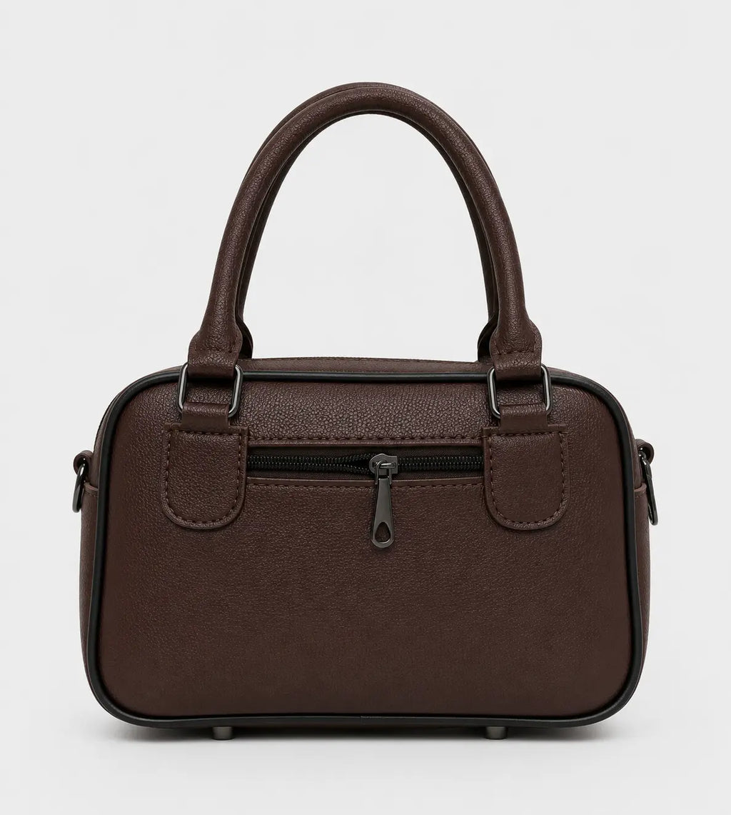 A dark brown textured faux-leather handbag with dual top handles, a front zippered pocket, and side pockets, shown against a plain light gray background.
