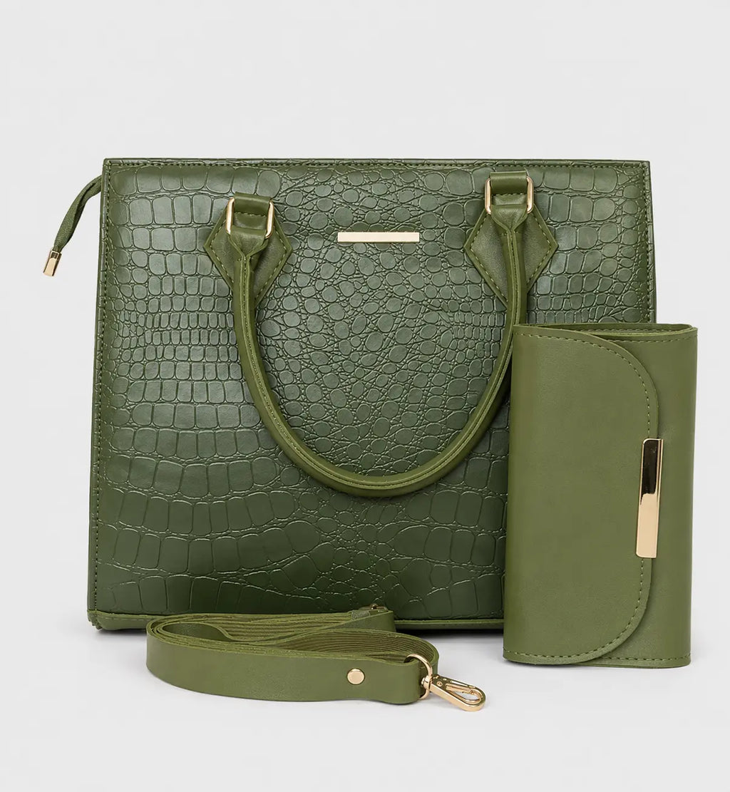 An olive green handbag set with a crocodile-embossed texture, featuring dual top handles, a detachable shoulder strap, and a matching zippered wallet or card holder, shown on a light gray background.