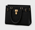 A structured black handbag with a subtle woven texture, featuring dual top handles, a central horizontal strap with gold-tone hardware, and a prominent gold padlock clasp on the front.