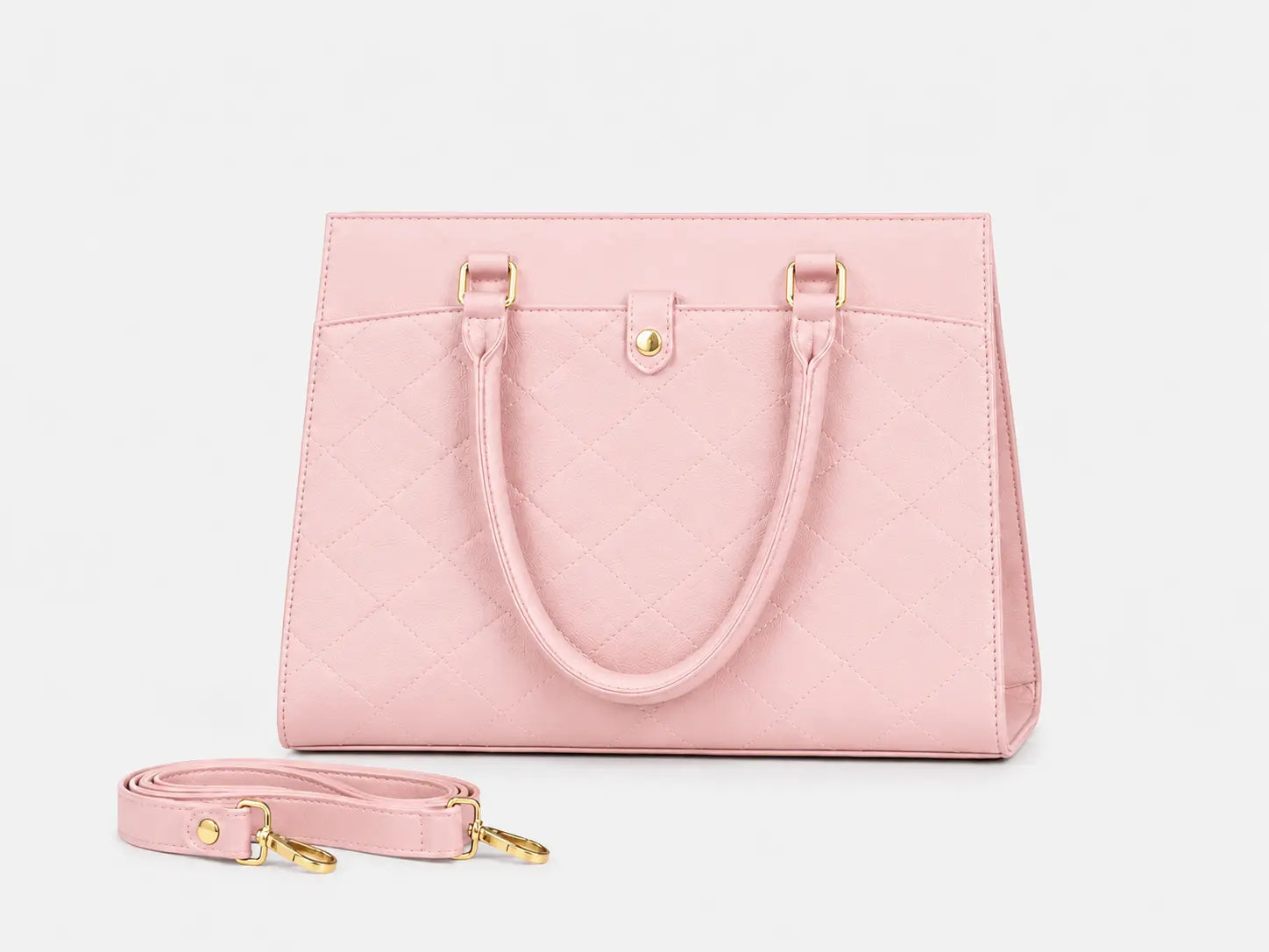 A light pink quilted leather handbag with dual top handles and a matching detachable shoulder strap, displayed on a clean white background.