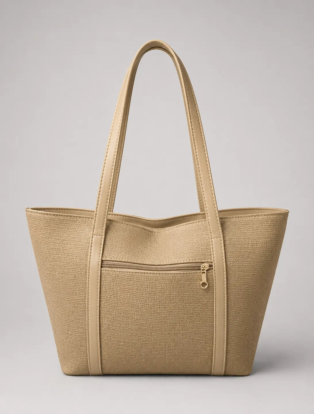 A structured beige tote bag with a textured woven pattern, dual shoulder straps, and a front zippered pocket, shown against a neutral gray background.