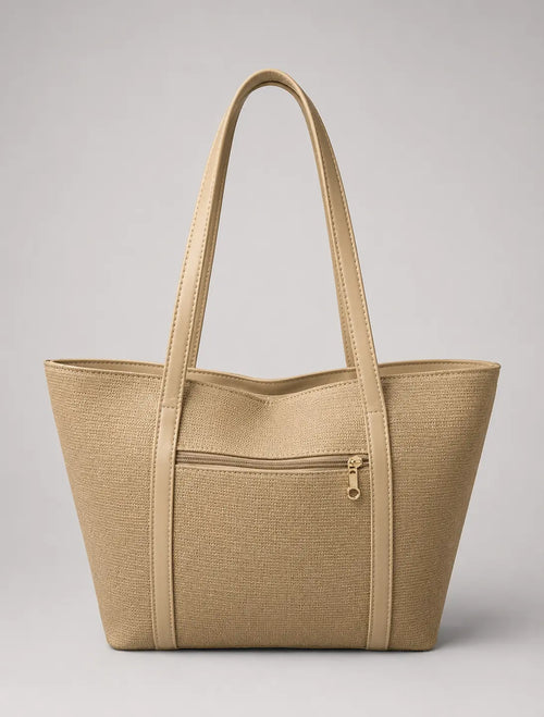 A structured beige tote bag with a textured woven pattern, dual shoulder straps, and a front zippered pocket, shown against a neutral gray background.