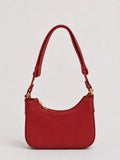 A red leather shoulder bag with a curved top, gold-tone hardware, and a matching red strap, shown against a light gray background.